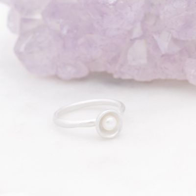 Nesting freshwater small pearl ring hand cast in sterling silver holding inside a small 4mm freshwater pearl