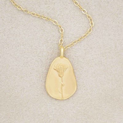 gold plated October birth flower necklace with an 18" gold filled link chain, on beige background