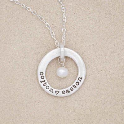 sterling silver open circle pearl necklace, on marble background