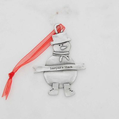 Snowman ornament hand-molded and cast in pewter hung from a sheer red ribbon and personalized with a phrase