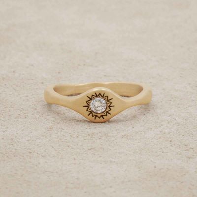 Sunburst stacking ring handcrafted in 10k yellow gold and set with a 3mm bright genuine diamond