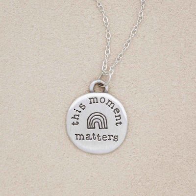 this moment matters pewter necklace on beige background