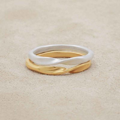 Twists and turns stacking ring handcrafted in yellow gold plated sterling silver with a satin finish stackable with other mix and match rings