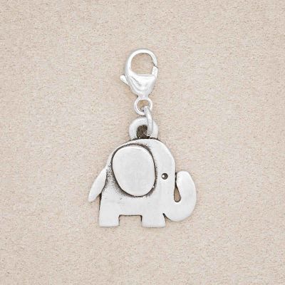 Wise Elephant Bracelet Charm handcrafted in sterling silver, on a suede background