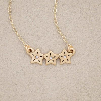 14k yellow gold your spark necklace with 1.5mm cubic zirconia in each star and strung on gold-filled chain chain