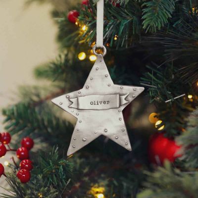 your spark ornament hand-molded and cast in fine pewter and personalized with a word, name or date, hanging on a christmas tree