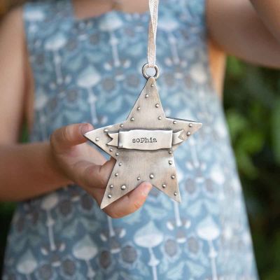 girl holding your spark ornament hand-molded and cast in fine pewter and personalized with a word, name or date